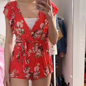 RED FLORAL ROMPER WITH RUFFLE DETAILING